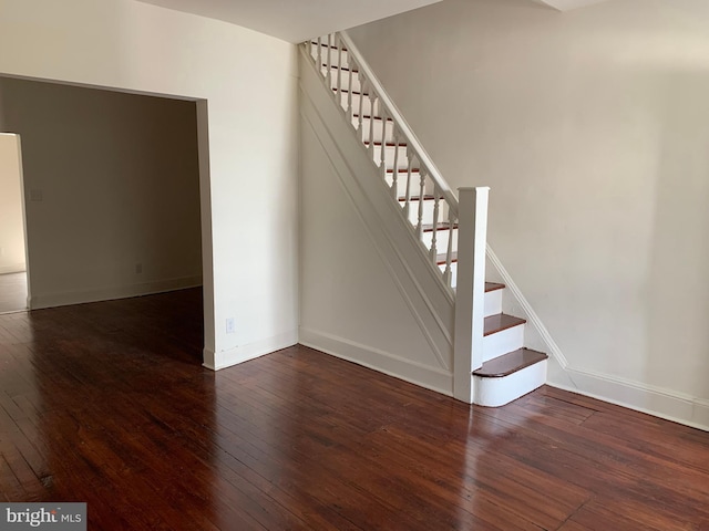 stairway featuring hardwood / wood-style floors