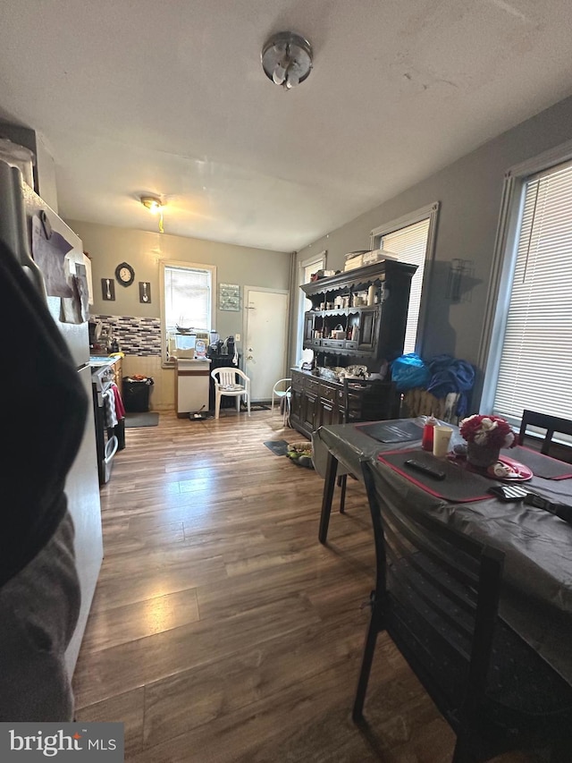 dining room with dark hardwood / wood-style floors