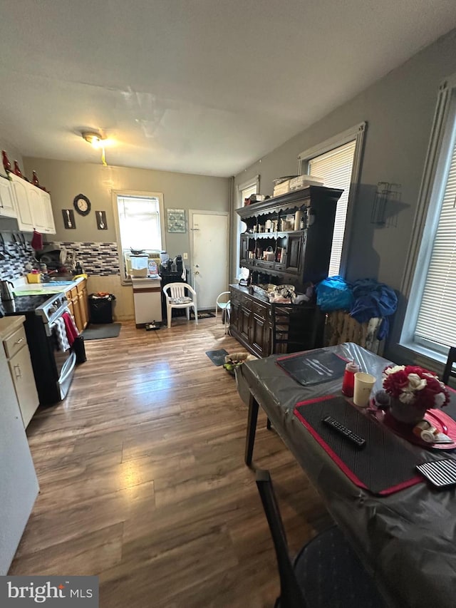 dining space with dark hardwood / wood-style floors