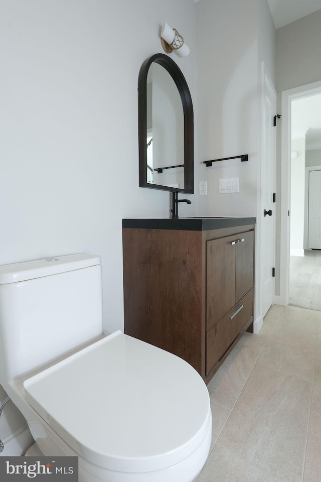 bathroom with tile patterned flooring and vanity