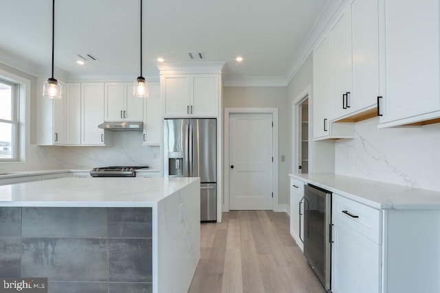 kitchen with white cabinets, stainless steel refrigerator with ice dispenser, light stone countertops, and hanging light fixtures