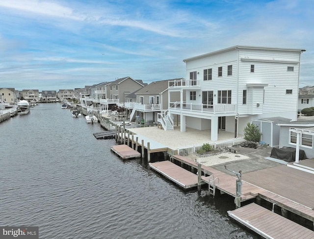 rear view of house with a water view