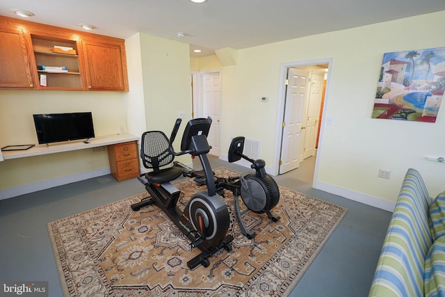 workout room featuring built in desk