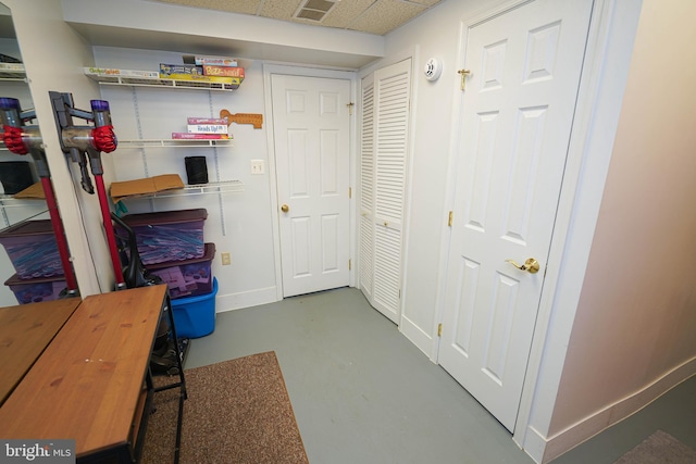 basement with a drop ceiling