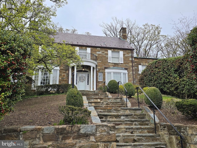 3195 Westover Dr SE, Washington, DC 20020 - view of front of house featuring a balcony, a chimney, and stone siding