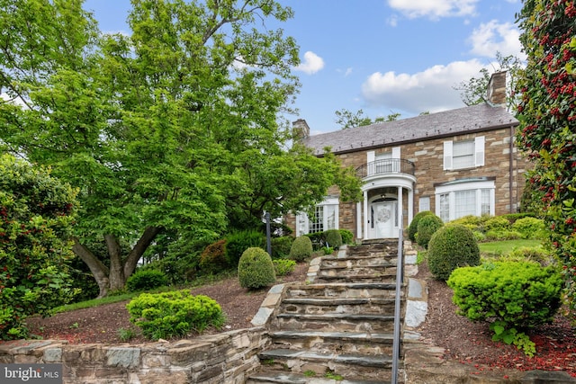 view of front of property with a balcony