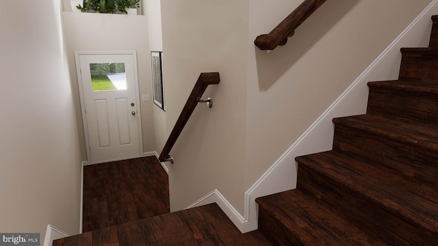 entryway with dark wood-type flooring