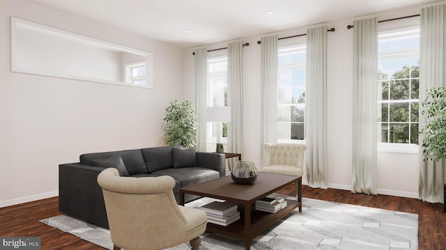 living room featuring plenty of natural light and dark hardwood / wood-style flooring