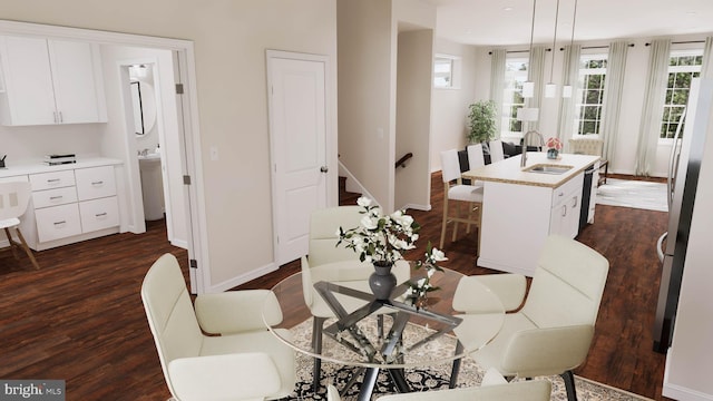 dining area with dark hardwood / wood-style flooring and sink