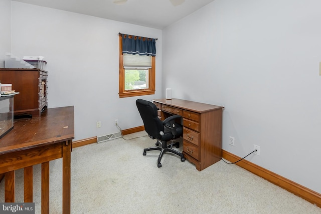 office area featuring light colored carpet