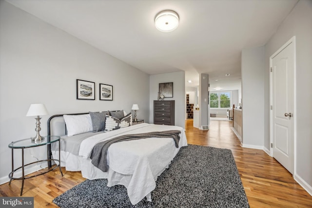 bedroom with hardwood / wood-style floors