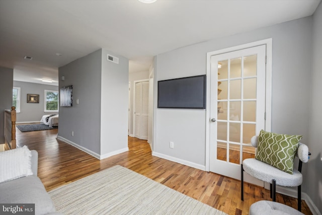 sitting room with hardwood / wood-style floors