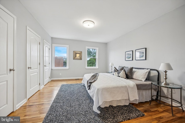 bedroom with hardwood / wood-style floors