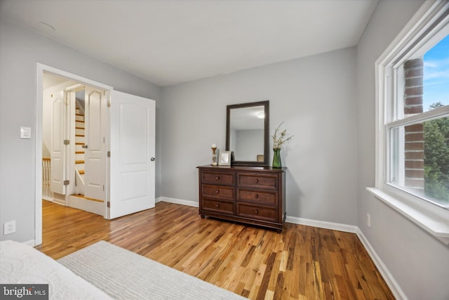 bedroom with light hardwood / wood-style floors