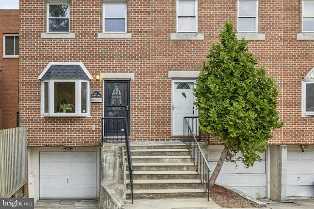 doorway to property with a garage