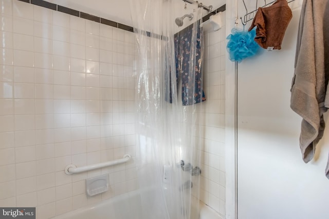 bathroom featuring shower / bath combination with curtain