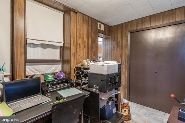 office featuring wood walls