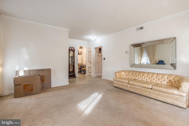 carpeted living room featuring ornamental molding