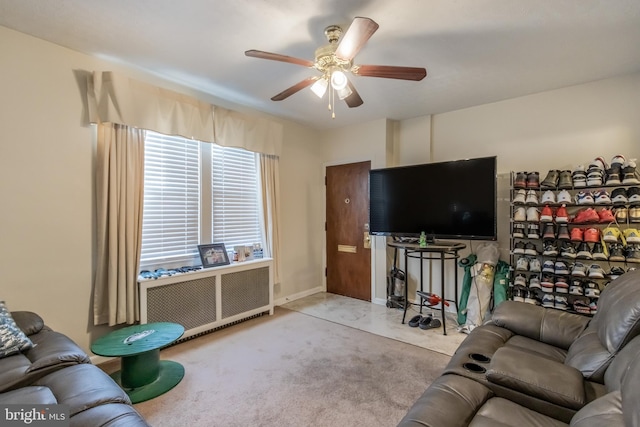 living room with light colored carpet and ceiling fan