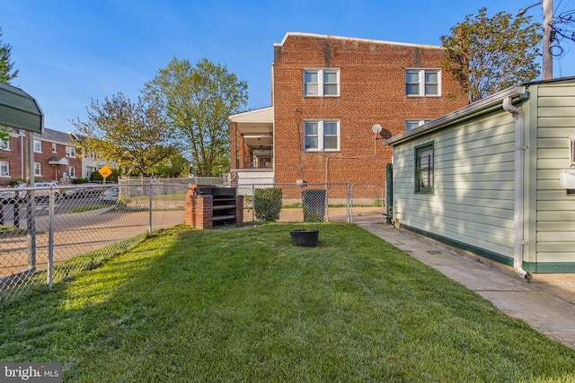 back of house with a lawn