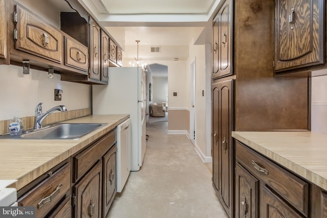 kitchen featuring dark brown cabinets, hanging light fixtures, dishwasher, sink, and a notable chandelier