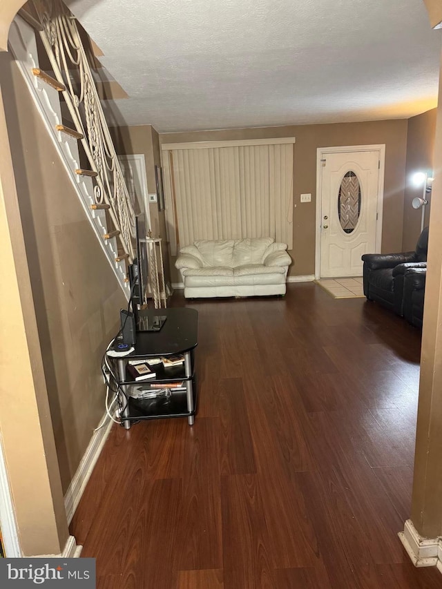 unfurnished living room with wood-type flooring