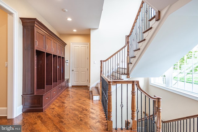 mudroom featuring baseboards, dark wood finished floors, and recessed lighting