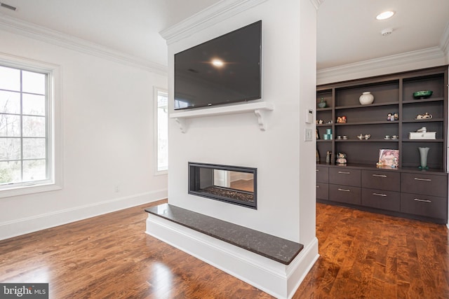 living room with recessed lighting, a multi sided fireplace, baseboards, dark wood finished floors, and crown molding