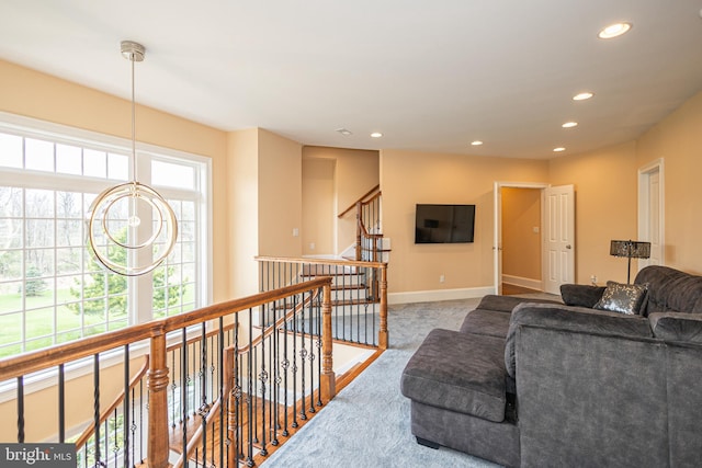 living area with carpet floors, recessed lighting, and baseboards