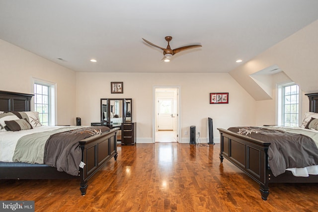 bedroom with baseboards, dark wood-type flooring, visible vents, and recessed lighting