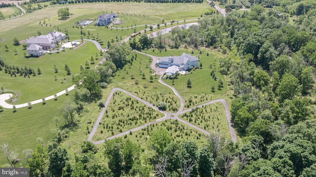 birds eye view of property with a rural view