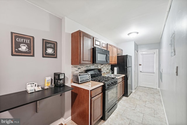 kitchen featuring black appliances, backsplash, and light tile patterned flooring