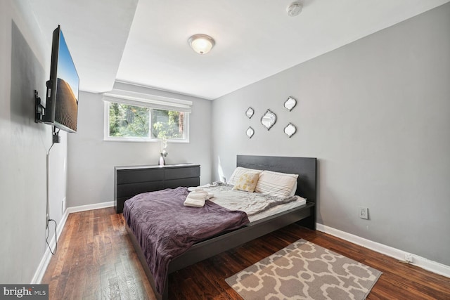 bedroom with wood-type flooring