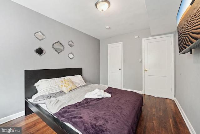 bedroom featuring dark hardwood / wood-style flooring