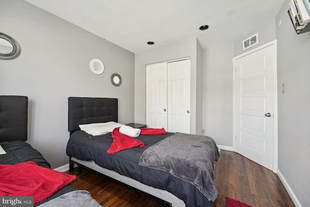 bedroom featuring dark hardwood / wood-style floors