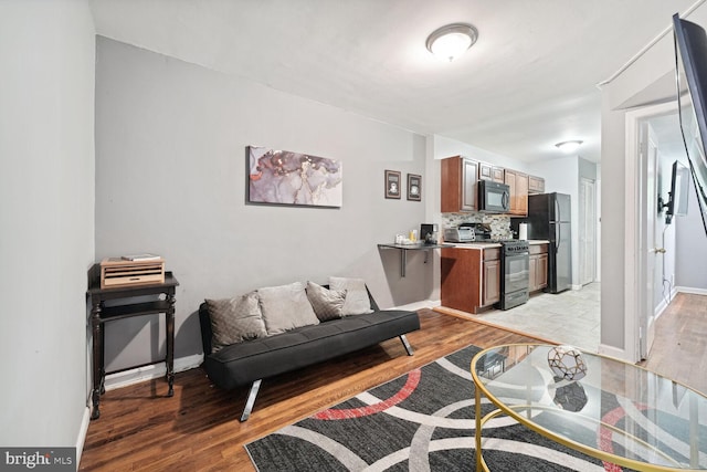 living room with light hardwood / wood-style flooring