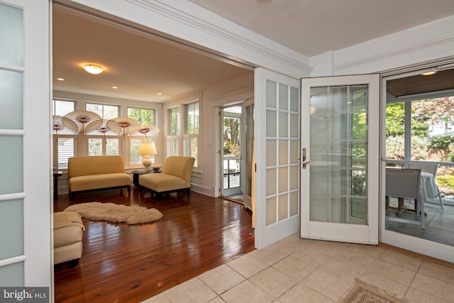 interior space with light hardwood / wood-style floors and french doors