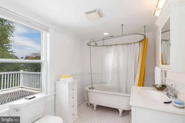 bathroom with vanity, tile floors, and toilet