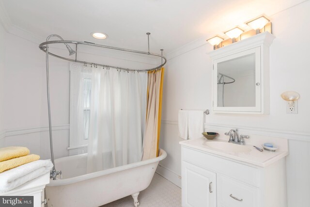 bathroom with tile flooring, shower / tub combo, vanity, and crown molding