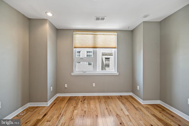 unfurnished room with light hardwood / wood-style floors