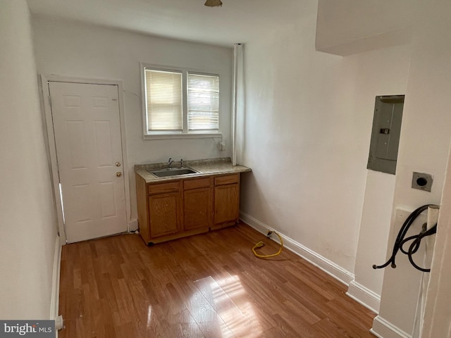 interior space with sink and light hardwood / wood-style floors