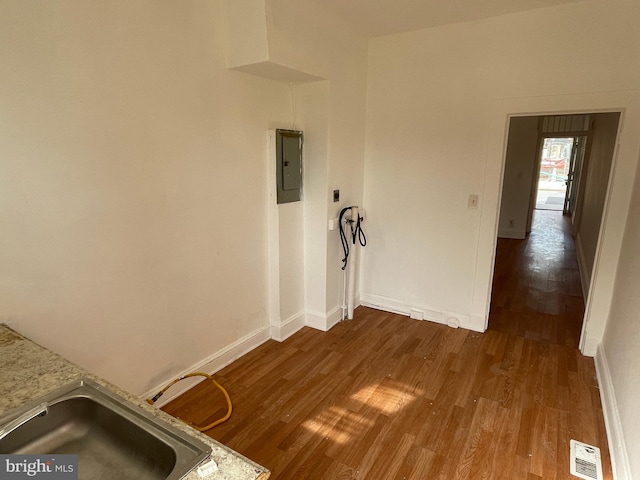 interior space featuring dark hardwood / wood-style flooring and sink