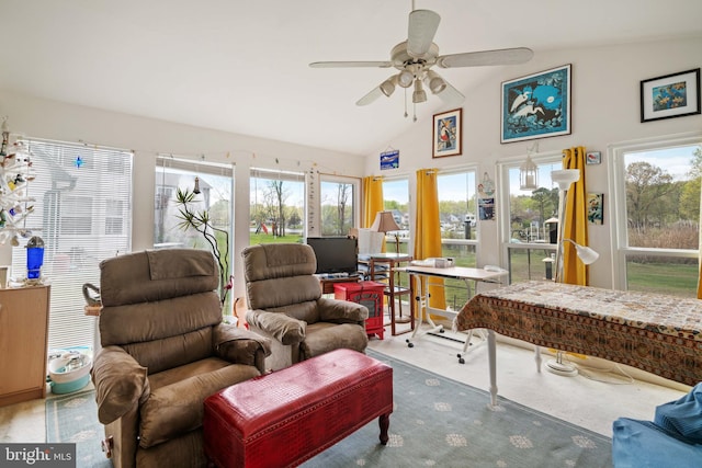 sunroom featuring lofted ceiling, plenty of natural light, and ceiling fan