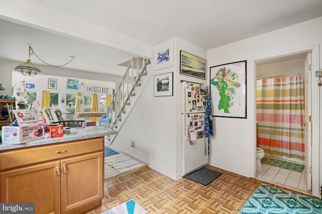 kitchen featuring hanging light fixtures and light parquet floors