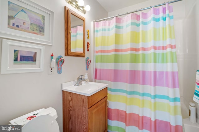 bathroom featuring vanity and toilet