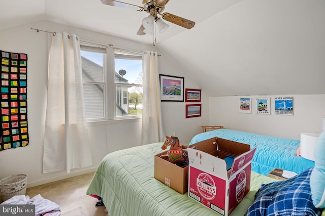 bedroom featuring light colored carpet, ceiling fan, and vaulted ceiling