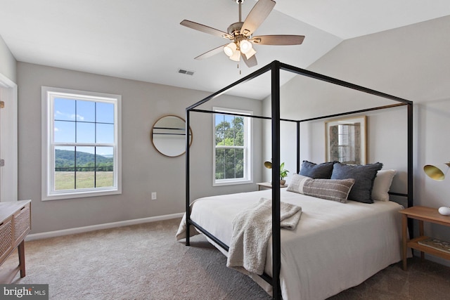 bedroom featuring ceiling fan, carpet flooring, and multiple windows