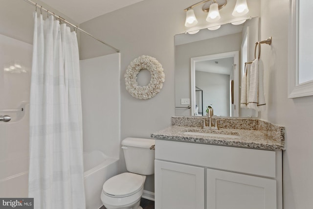 full bathroom featuring toilet, shower / bath combination with curtain, and vanity