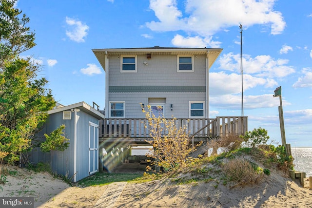 back of house featuring a wooden deck