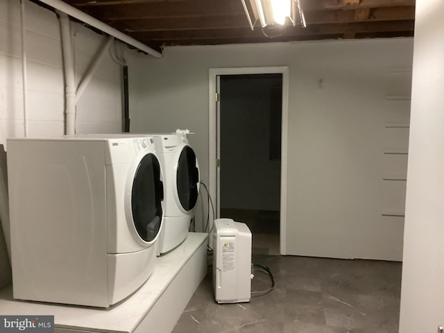 washroom with washer and dryer